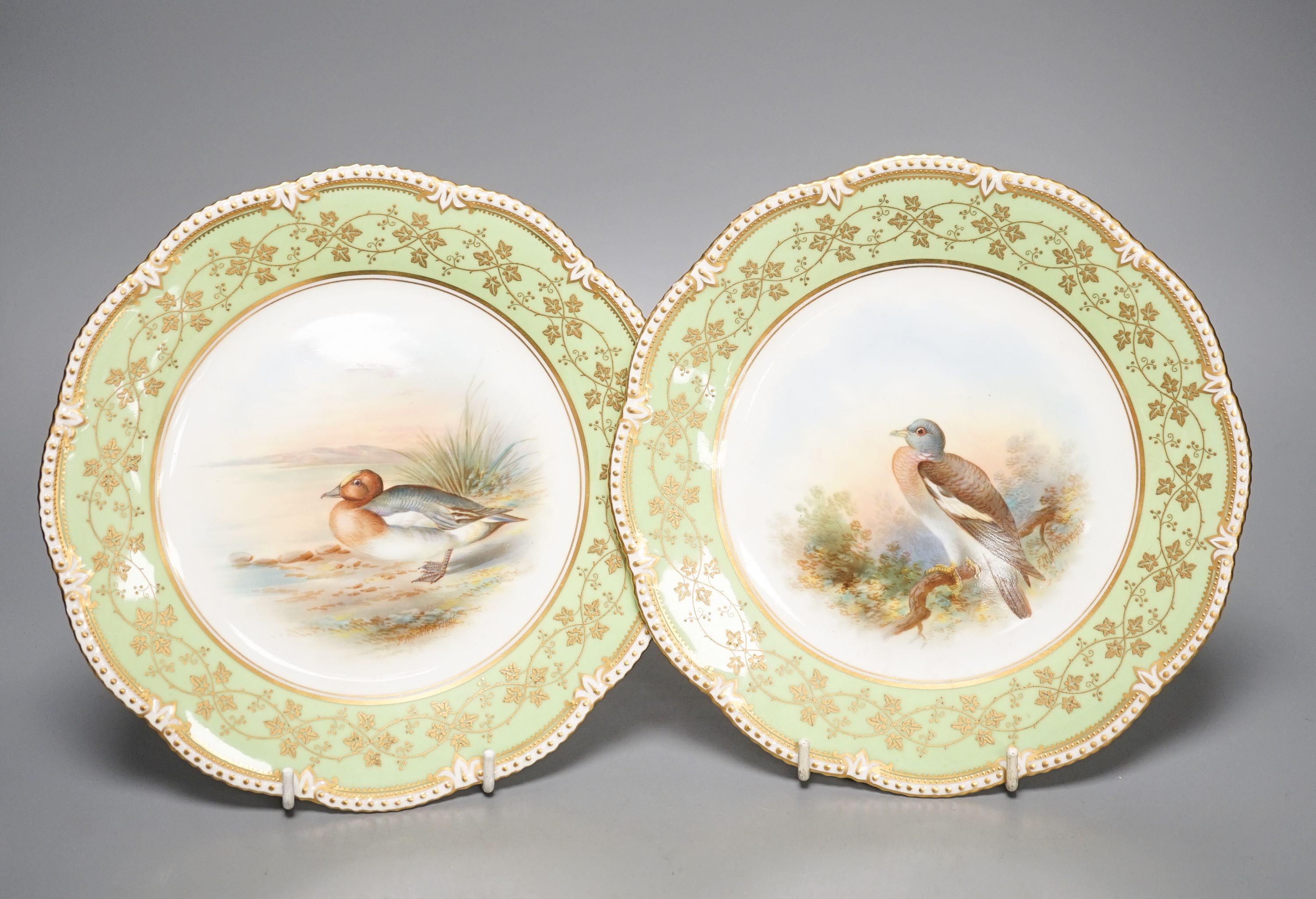 A late 19th century Aynsley pair of plates painted by F. Micklewright each signed, with a Widgeon or Wood Pigeon named verso 22cm